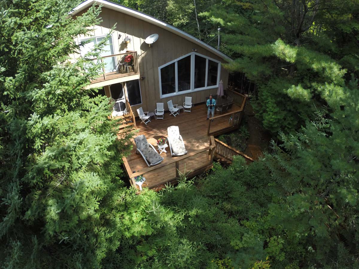 Aerial view showing large deck and private bedroom balcony